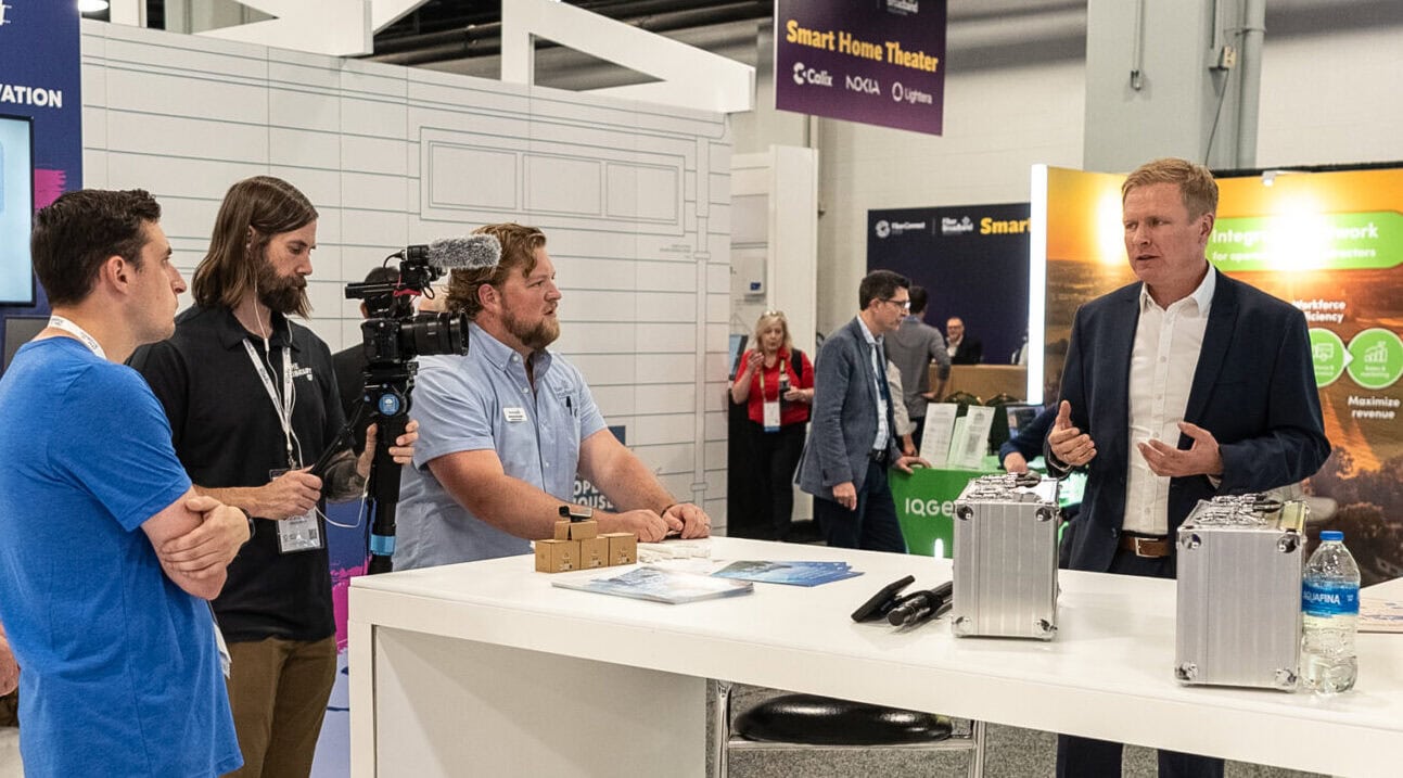 Film crew interviewing man