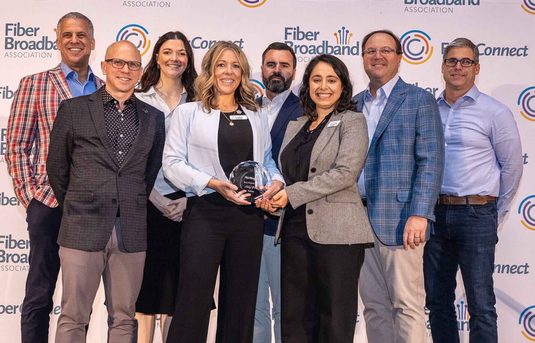 Adtran employees receiving award at Fiber Connect