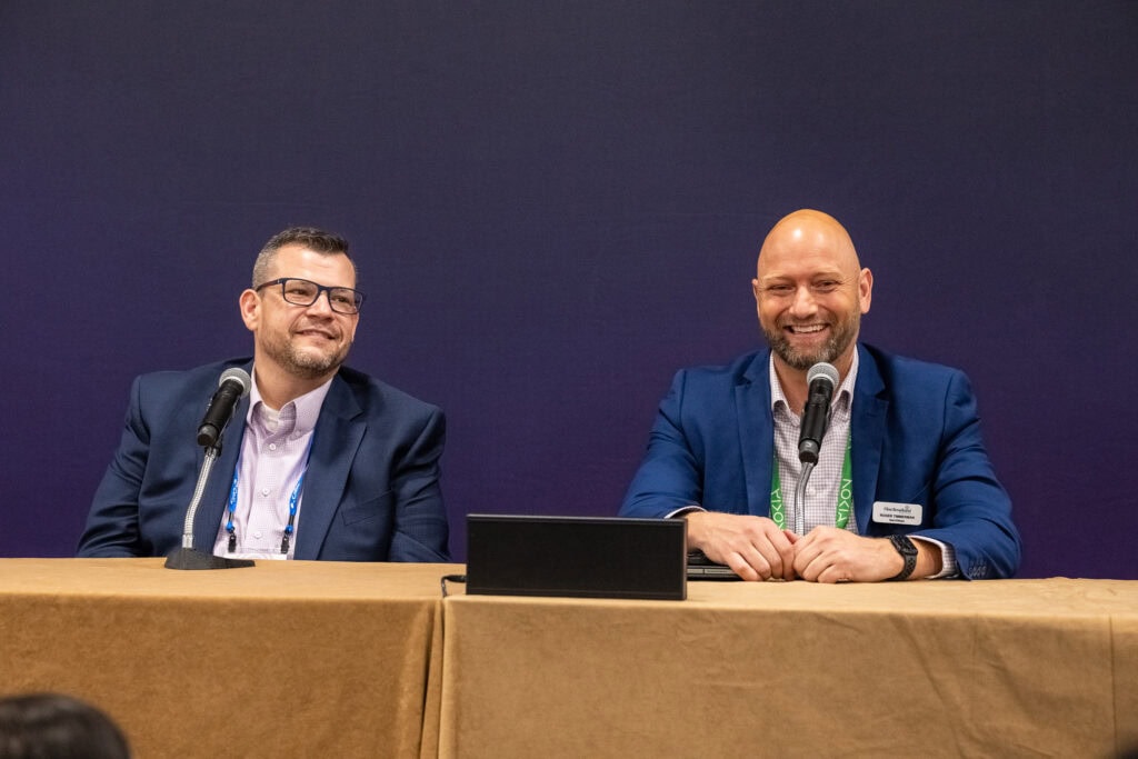 Two presenters at a table